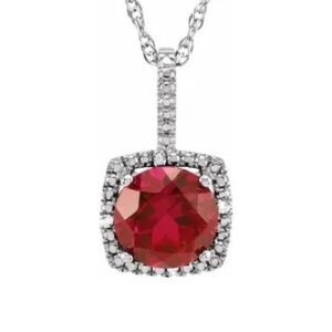 Sterling Silver Halo Ruby And Diamond Necklace With One 7mm Lab Grown Ruby And .015 CTW Natural Round Diamonds Sterling Silver Halo Ruby And Diamond Necklace With One 7mm Lab Grown Ruby And .015 CTW Natural Round Diamonds